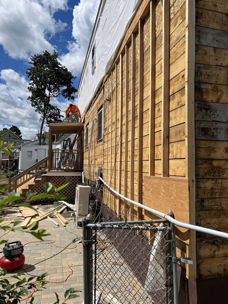 Side wall sheathing being repaired and replaced