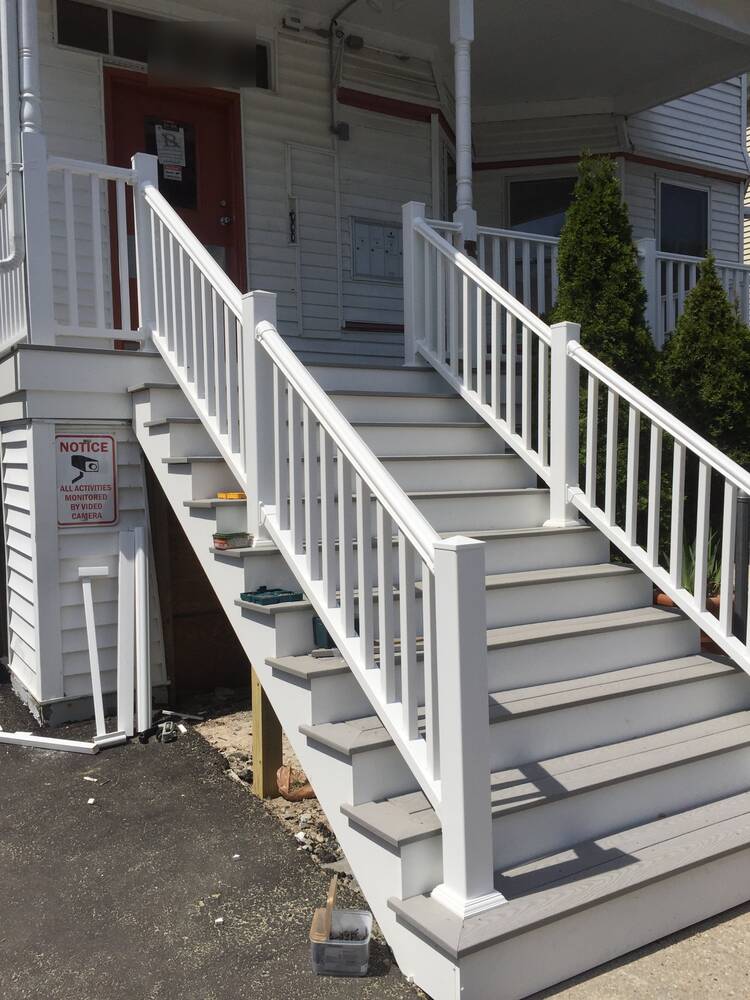 Close view of the new stair railings and composite treads
