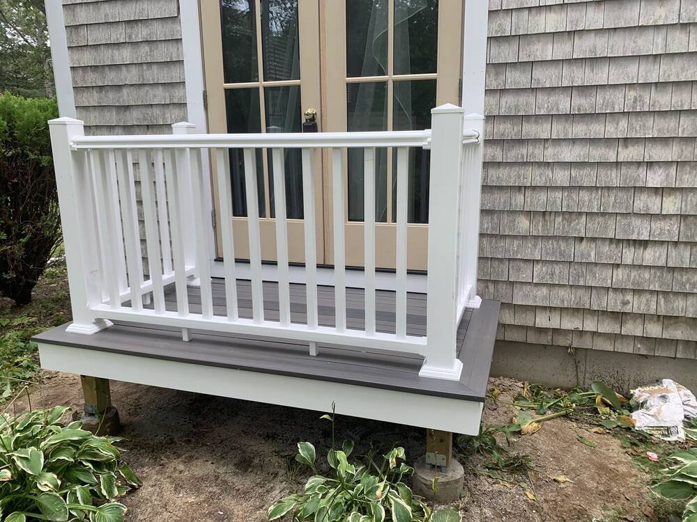 Finished landing with white vinyl railings