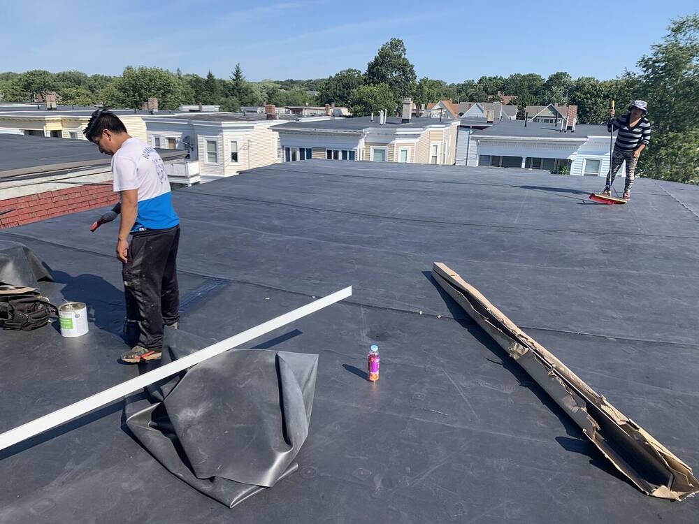 Black EPDM rubber membrane installed across the flat roof