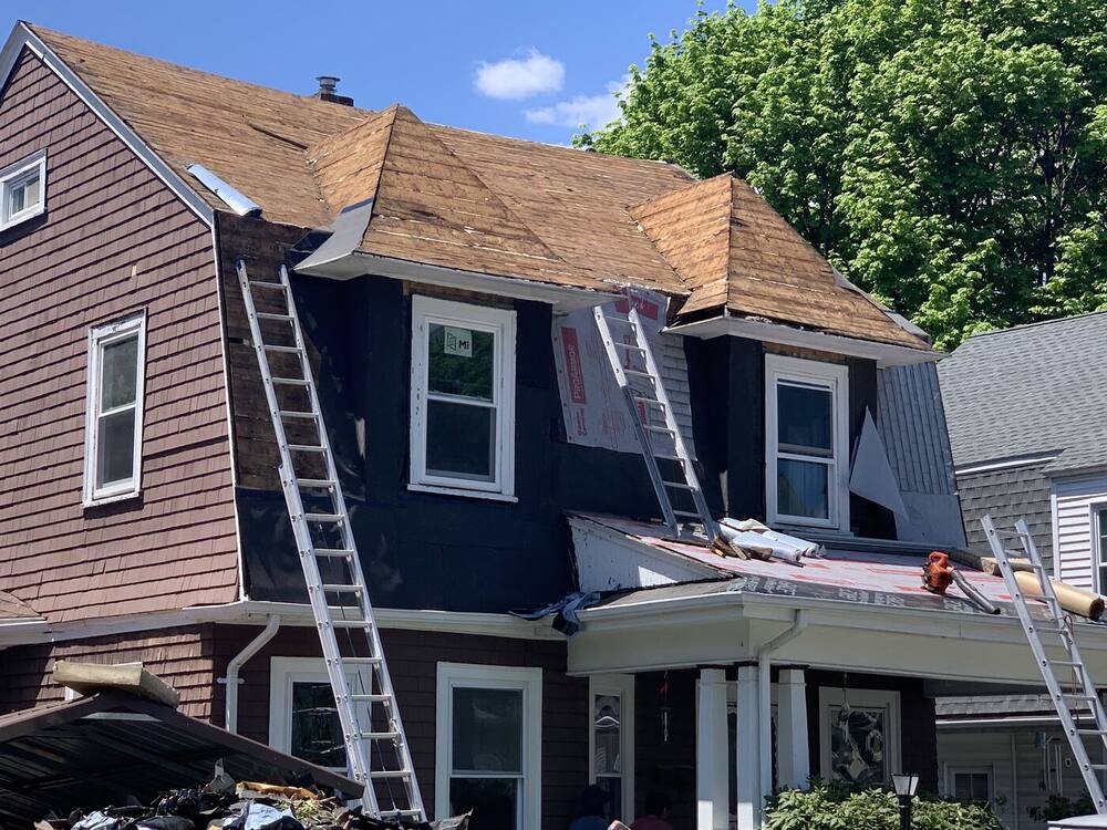 Gambrel roof stripped to the boards and ready for new underlayment