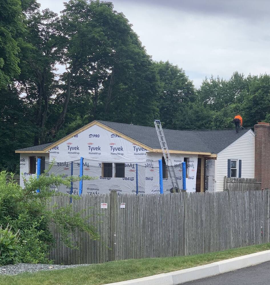 Ranch wrapped in Tyvek ready for new siding